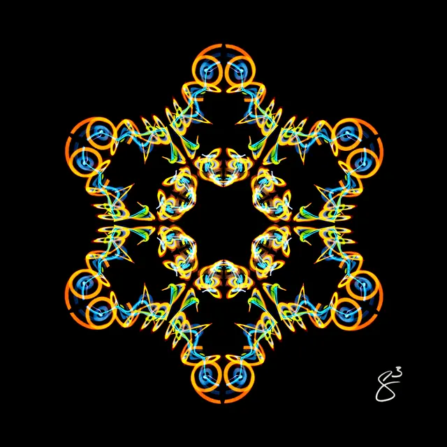 A six-pointed star of orange rings tipped with speaker-cone circles, formed from light trails, on black.